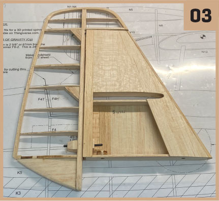 Wooden aircraft rudder frame on technical blueprint, upper right corner shows "03".