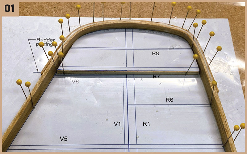 Wooden frame pinned on paper with grid, labeled sections, and "Rudder parting."