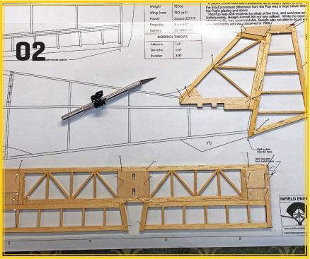 Blueprint with wooden model frame, pen, and drafting compass.