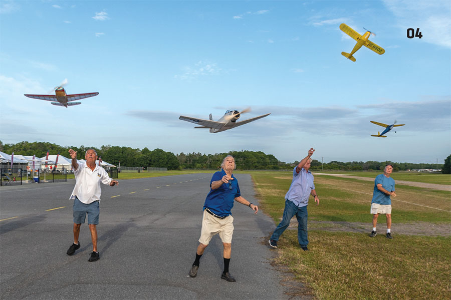 Men launching remote-controlled planes on a sunny day.