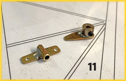 Two small metal brackets on a geometric drawing labeled 11.