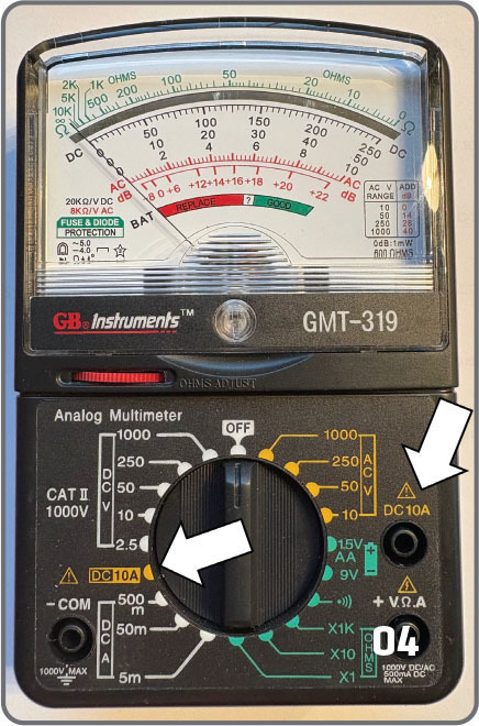Analog multimeter GMT-319 with dial and measurement scales.