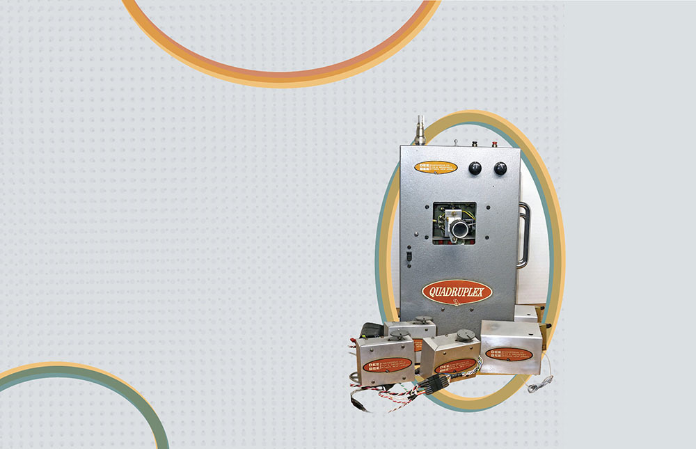 Control panel labeled "QUADRUPLEX" with various components, on a dotted background.