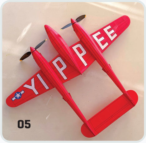 Red toy plane with "YIPPEE" text on wings.