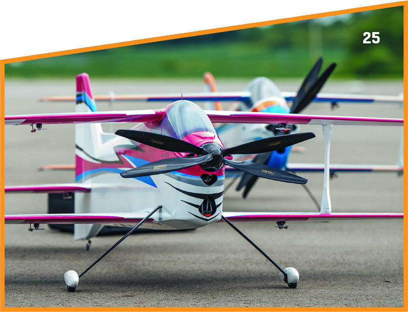 Model airplanes on tarmac, vibrant colors, number 25 in corner.