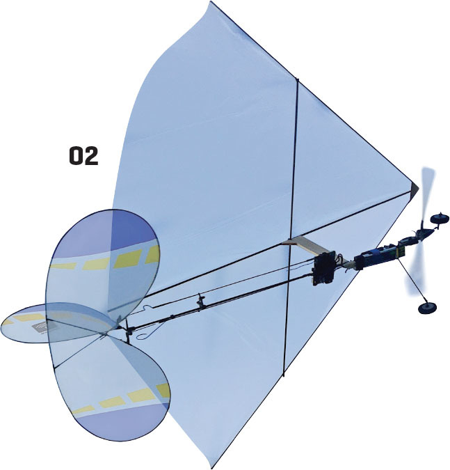 Small blue model aircraft with large propeller and numbered "02".