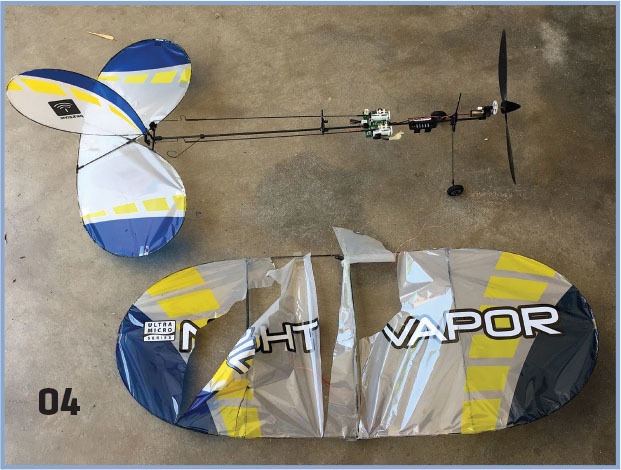 Remote-controlled airplane with blue and yellow wings, text reads "Night Vapor."