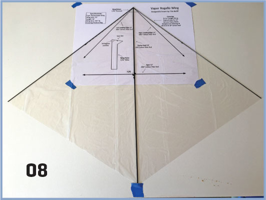 Kite assembly instructions on a beige kite, numbered 08 in the corner.