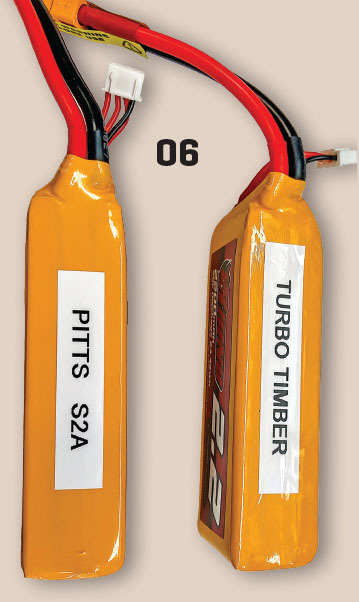 Two yellow battery packs labeled "PITTS S2A" and "TURBO TIMBER," with red and black wires.