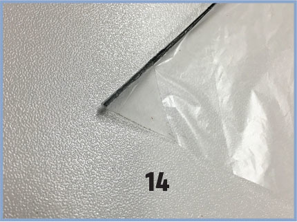 Embossed silver paper, number 14.