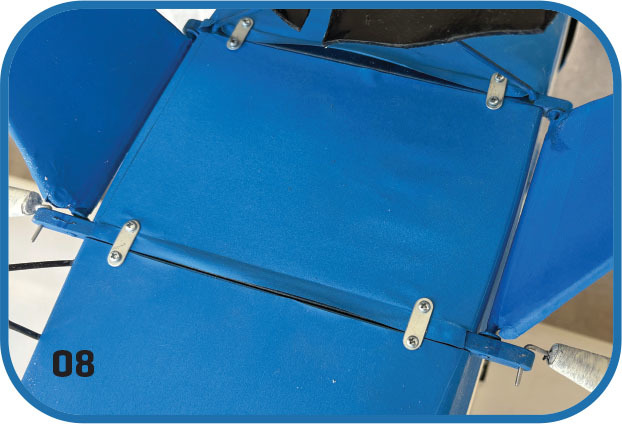 Blue mechanical assembly with bolts, number 08 in bottom left.