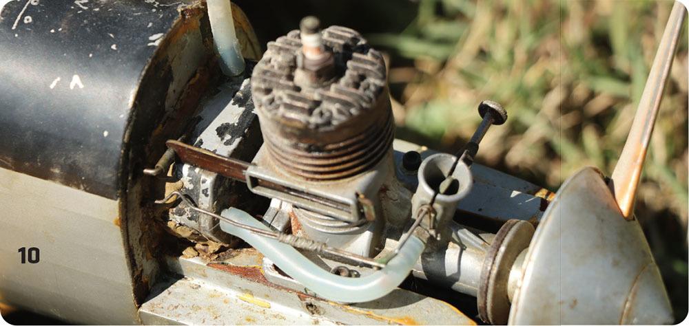 Rusty model engine with metal parts, number 10 visible.