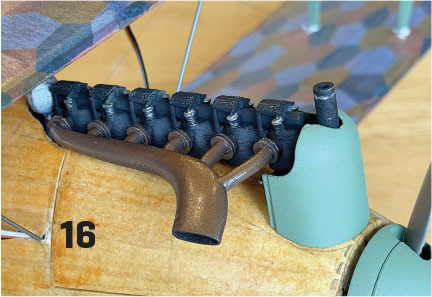 Close-up of a model airplane engine with the number 16 on the side.