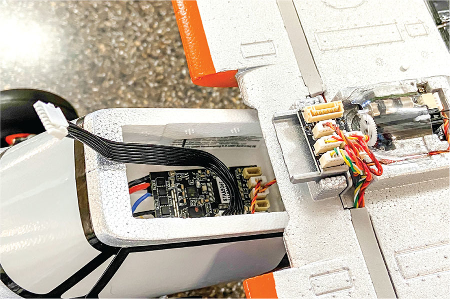 Model aircraft internal electronics, wires connected to circuit board and components.