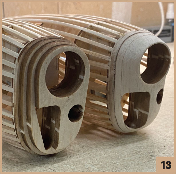 Wooden lattice structures resting on a table, numbered 13.