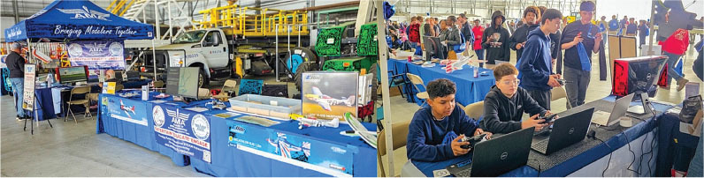 Exhibition booth with banners, laptops, and boys using game controllers at a tech fair.