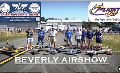 BEVERLY AIRSHOW, group displaying model aircraft, banners above.