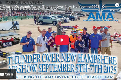 Thunder Over New Hampshire Airshow, September 5-7, 2025. Group posing near model aircraft.