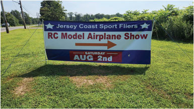 RC Model Airplane Show banner, August 2nd, on grass.