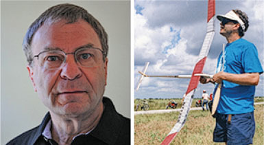Man in glasses looks forward; man in blue shirt holds model airplane outdoors.