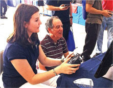 Woman and man gaming together on controllers indoors.