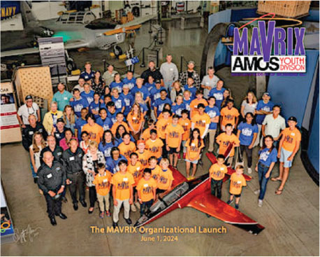 Group photo of MAVRIX launch, diverse people in orange and blue shirts, June 1, 2024.