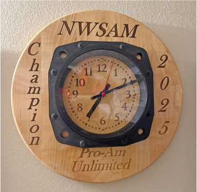 Clock on wooden plaque with text "NWSAM Champion 2025 Pro-Am Unlimited."