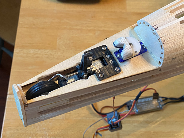 Wooden aircraft nose with retractable landing gear mechanism.