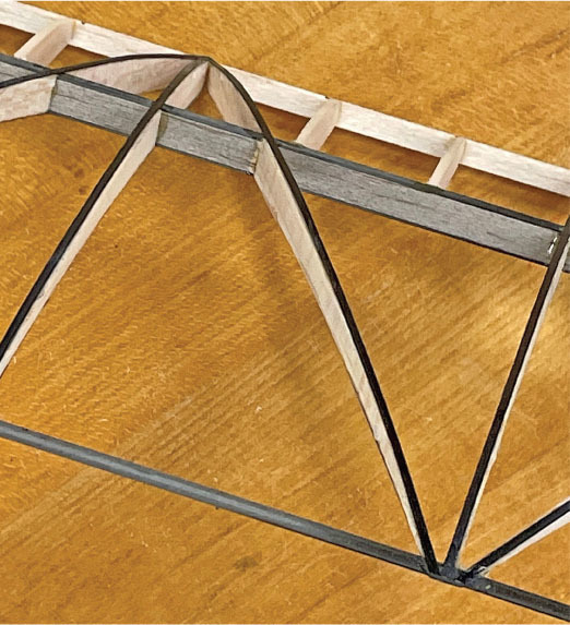 Extensive use of carbon-fiber strips stiffens this extremely lightweight wing structure.