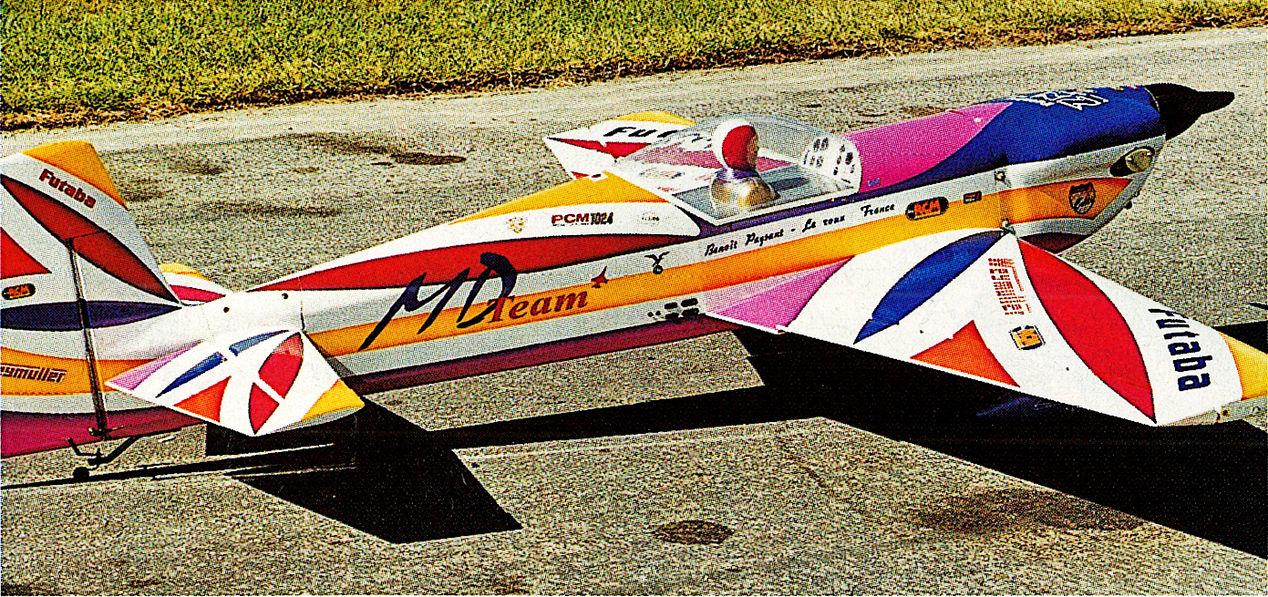 Model airplane with colorful graphics on a runway.