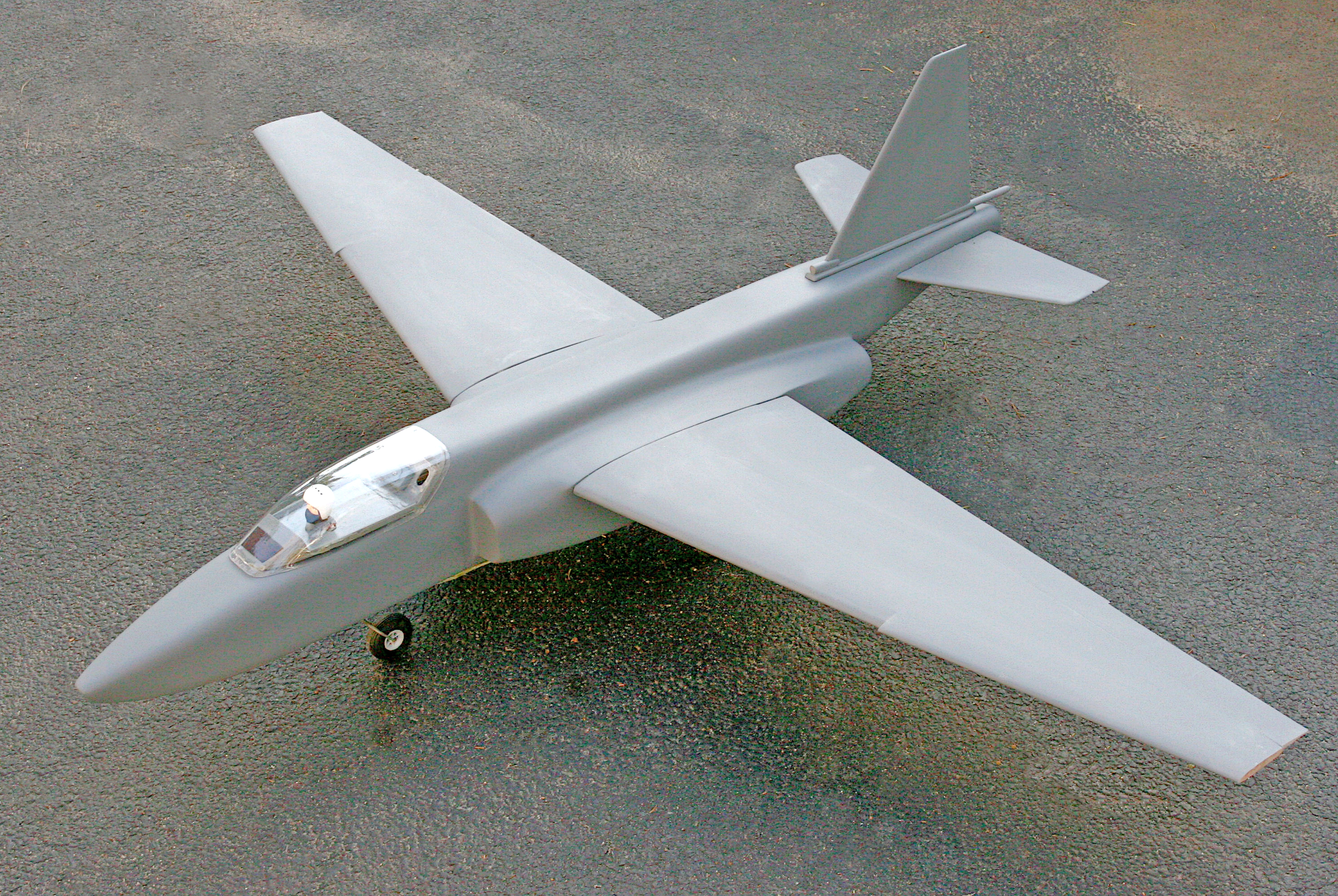 Model jet plane on a rough surface.