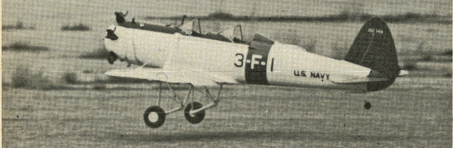 US Navy aircraft 3-F-1 landing on a runway.