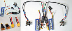 Battery packs with connectors and wires on white background.