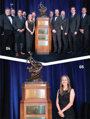 Group and woman in formal attire with large trophy.