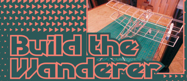 Build the Wanderer text with model plane on cutting mat.