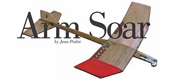 Arm Soar text with glider illustration in beige and red.