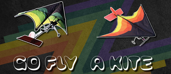 Two colorful kites and text "GO FLY A KITE" on a dark geometric background.