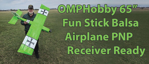 Person holding green model airplane. Text: "OMPHobby 65” Fun Stick Balsa Airplane PNP Receiver Ready."