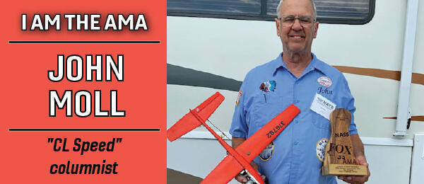 John Moll stands holding his CL Speed model