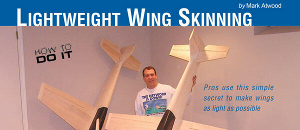 Lightweight Wing Skinning by Mark Atwood. Person holding model airplane wings.