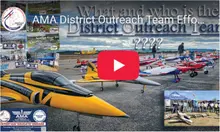AMA District Outreach Team Effort banner with model aircraft on display.