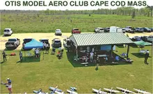 OTIS MODEL AERO CLUB CAPE COD MASS. Pavilion with people and model planes on grass.